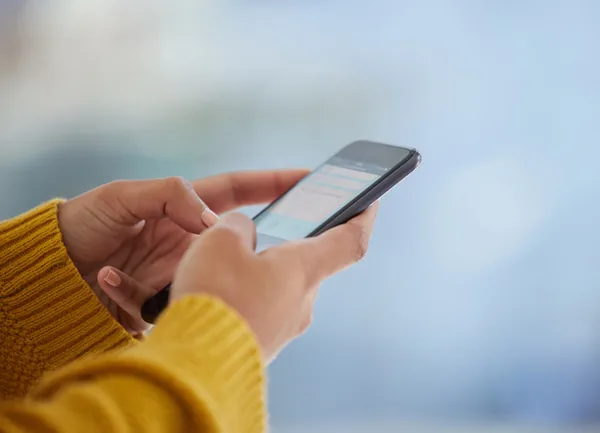 Hands holding a smartphone